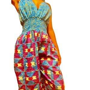 blue multi colored halter african print flowy jumpsuit 
ties at neck;